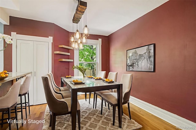 351 Bannock St, Denver, CO 80223 - dining area with light wood finished floors and a chandelier
