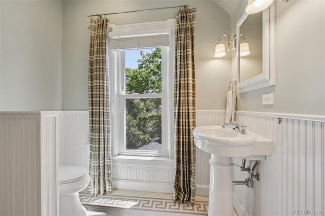 351 Bannock St, Denver, CO 80223 - bathroom featuring a wainscoted wall and toilet