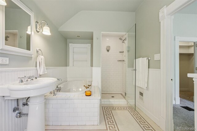 351 Bannock St, Denver, CO 80223 - bathroom featuring a bath, a tile shower, and wainscoting