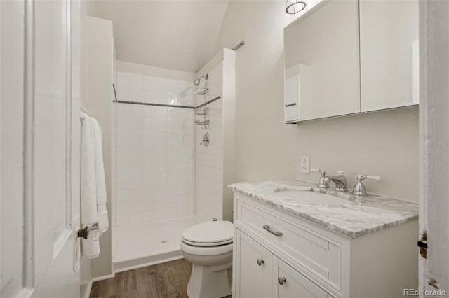 351 Bannock St, Denver, CO 80223 - bathroom with vanity, a shower stall, and wood finished floors