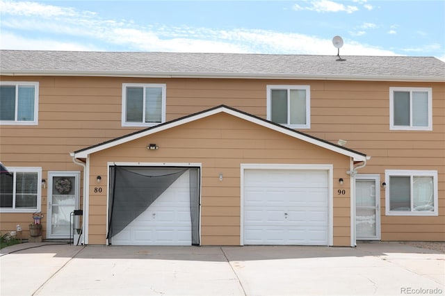 view of front of property with a garage