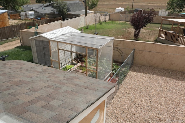 view of yard featuring a patio area and an outbuilding