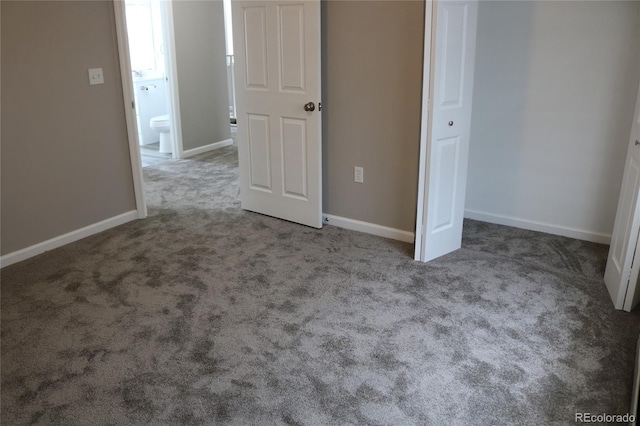 unfurnished bedroom featuring light carpet