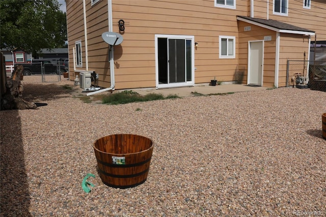 rear view of house with a patio