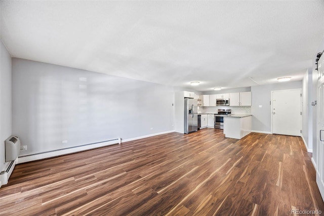 610 S Alton Way Unit 7C, Denver, CO 80247 - unfurnished living room with dark wood-style flooring and baseboards