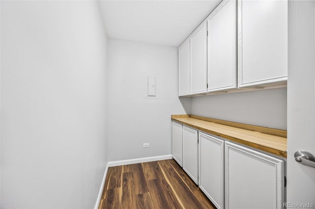 610 S Alton Way Unit 7C, Denver, CO 80247 - laundry room with dark wood finished floors and baseboards