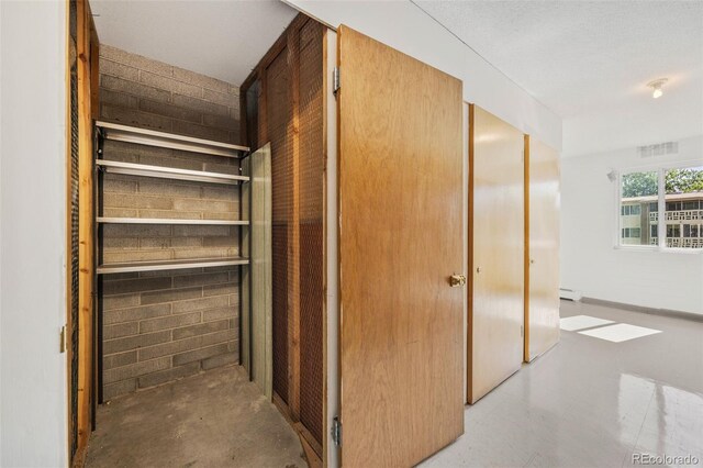 610 S Alton Way Unit 7C, Denver, CO 80247 - closet with a baseboard heating unit