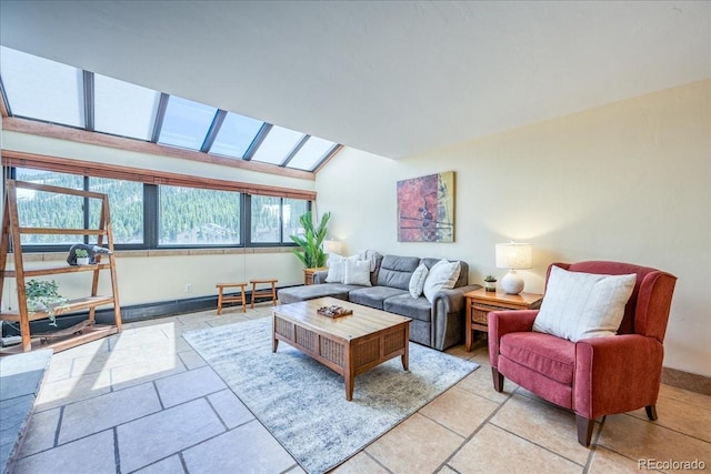 189 Ten Mile Cir Unit 551, Frisco, CO 80443 - living room featuring lofted ceiling, a skylight, and baseboards