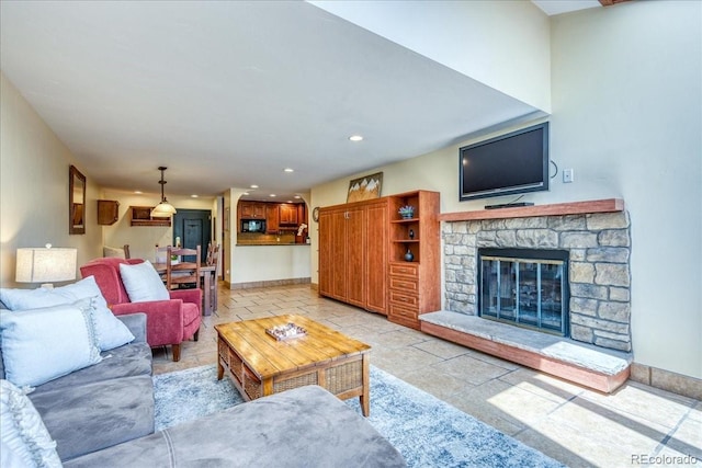 189 Ten Mile Cir Unit 551, Frisco, CO 80443 - living area featuring a stone fireplace, recessed lighting, and baseboards