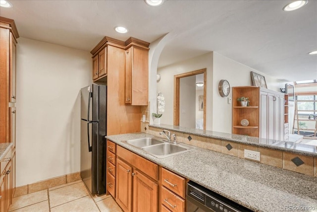 189 Ten Mile Cir Unit 551, Frisco, CO 80443 - kitchen with a sink, freestanding refrigerator, recessed lighting, baseboards, and light tile patterned floors