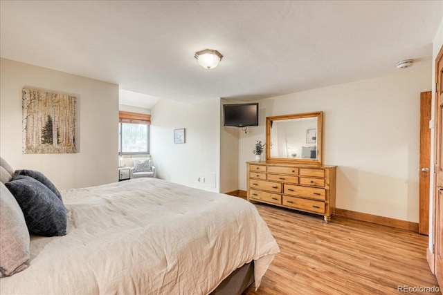 189 Ten Mile Cir Unit 551, Frisco, CO 80443 - bedroom with light wood-style flooring and baseboards