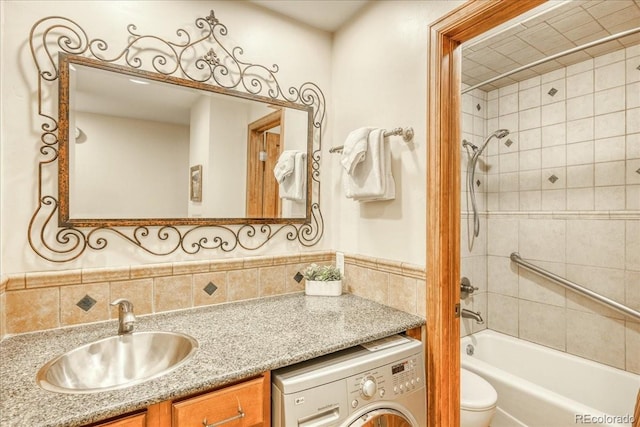 189 Ten Mile Cir Unit 551, Frisco, CO 80443 - bathroom featuring washer / dryer, vanity, toilet, and shower / bathtub combination