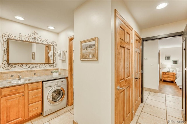 189 Ten Mile Cir Unit 551, Frisco, CO 80443 - laundry area with washer / dryer, light tile patterned floors, and recessed lighting