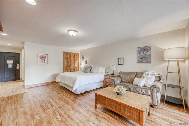 189 Ten Mile Cir Unit 551, Frisco, CO 80443 - bedroom with light wood-type flooring, baseboards, and recessed lighting