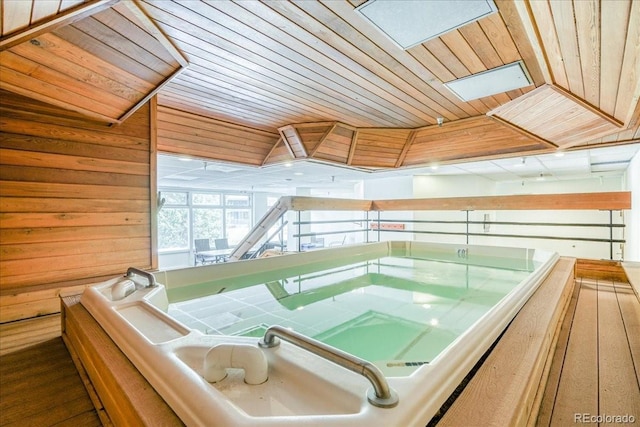 189 Ten Mile Cir Unit 551, Frisco, CO 80443 - miscellaneous room featuring wooden ceiling, a jacuzzi, and wood walls