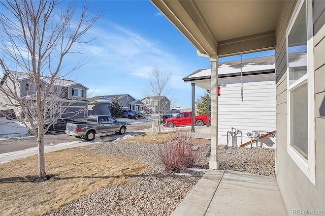 view of yard featuring covered porch