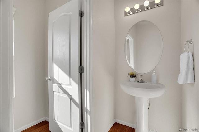 bathroom with wood-type flooring