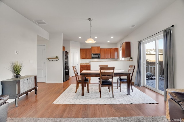 dining area featuring light hardwood / wood-style flooring