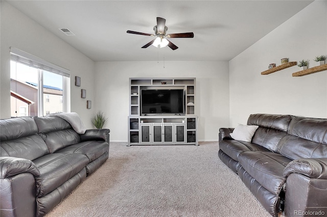 carpeted living room featuring ceiling fan