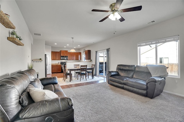 living room with ceiling fan