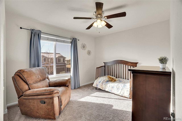 bedroom featuring ceiling fan and light colored carpet