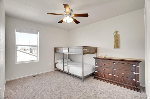 bedroom featuring ceiling fan and light colored carpet