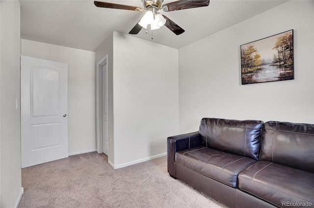 living room featuring ceiling fan and light colored carpet