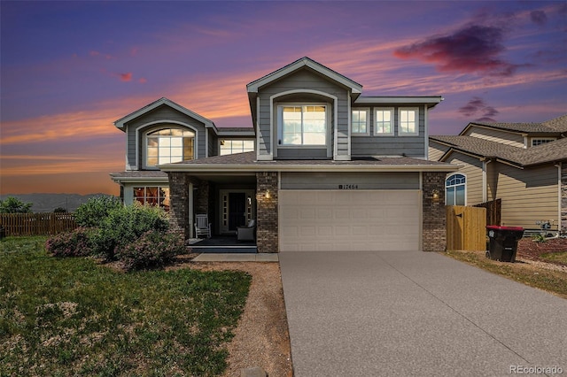 17464 Crestview Ct, Monument, CO 80132 - traditional home featuring brick siding, an attached garage, and driveway
