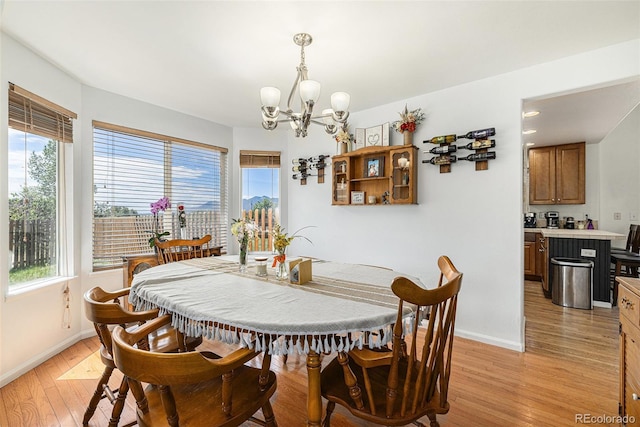 17464 Crestview Ct, Monument, CO 80132 - dining space with a chandelier and light wood-style flooring