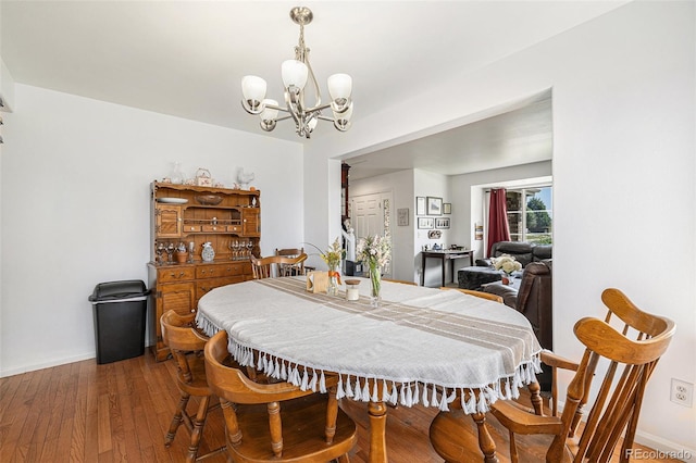 17464 Crestview Ct, Monument, CO 80132 - dining space featuring a chandelier and wood-type flooring