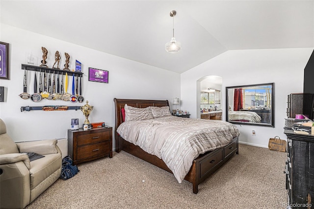 17464 Crestview Ct, Monument, CO 80132 - bedroom featuring vaulted ceiling, light colored carpet, and arched walkways
