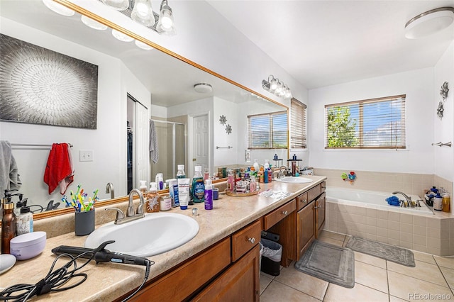 17464 Crestview Ct, Monument, CO 80132 - bathroom featuring double vanity, a garden tub, tile patterned floors, and a shower stall