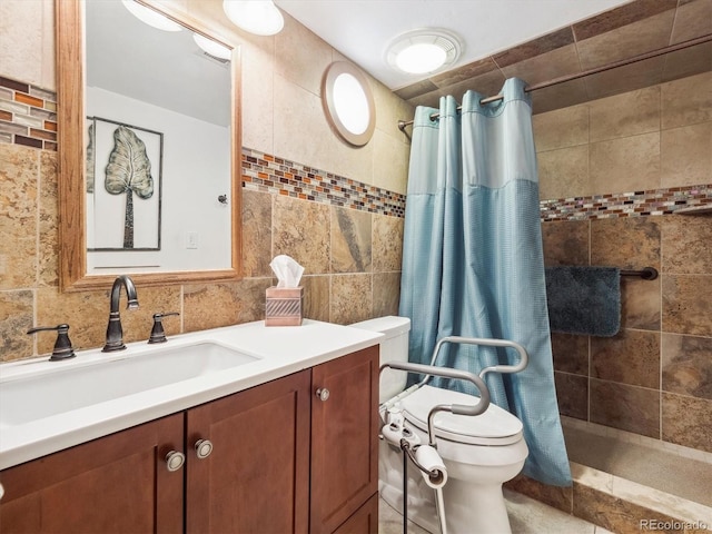 full bathroom featuring toilet, vanity, tile walls, and tiled shower