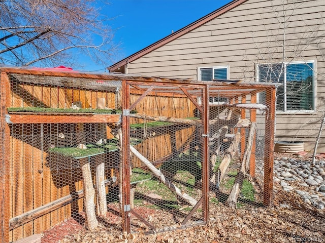 view of gate featuring exterior structure and an outdoor structure