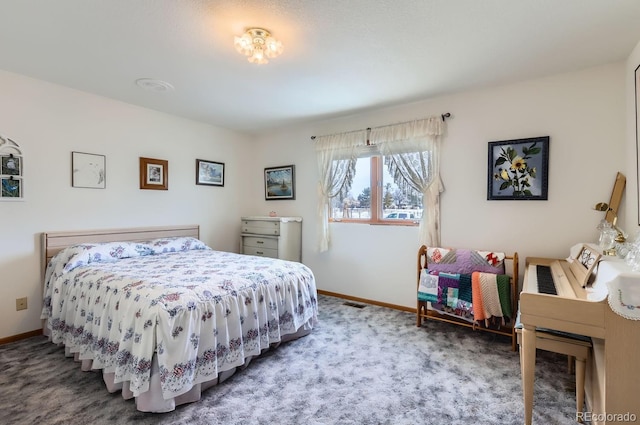 bedroom with carpet and baseboards