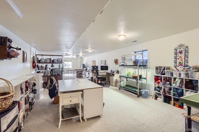 office area featuring carpet flooring and a textured ceiling
