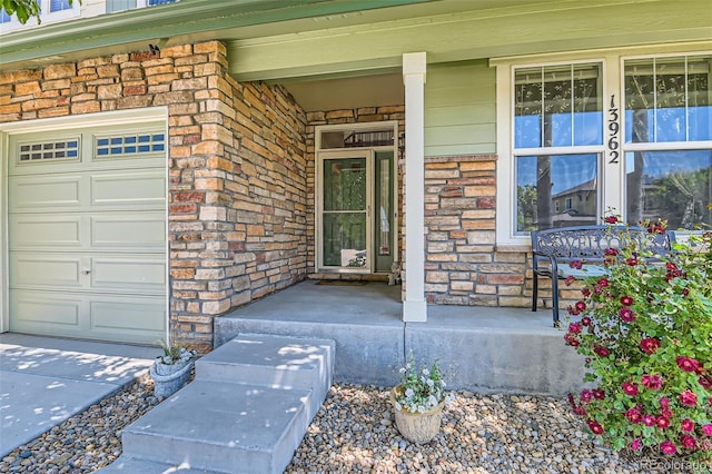 13962 Dexter Way, Thornton, CO 80602 - entrance to property featuring covered porch, brick siding, and stone siding