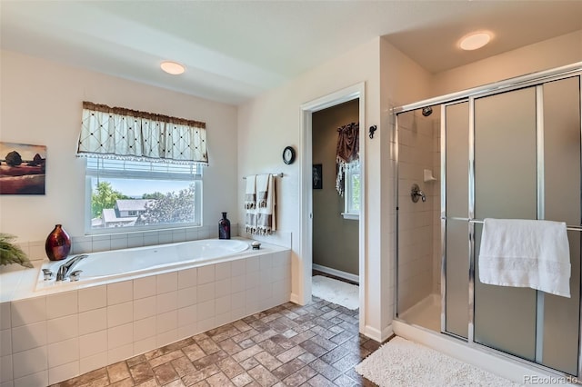 13962 Dexter Way, Thornton, CO 80602 - full bathroom with a shower stall, a garden tub, and brick patterned floors