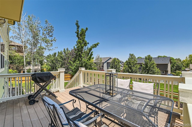 13962 Dexter Way, Thornton, CO 80602 - wooden terrace featuring outdoor dining area and a residential view