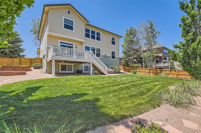 13962 Dexter Way, Thornton, CO 80602 - rear view of house featuring stairs, a wooden deck, and a fenced backyard