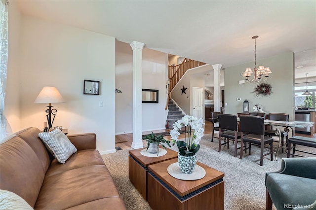 13962 Dexter Way, Thornton, CO 80602 - living room with ornate columns, stairs, a chandelier, and light colored carpet