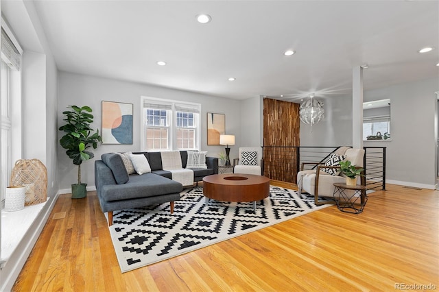 4451 Eliot St, Denver, CO 80211 - living area with healthy amount of natural light, wood finished floors, and recessed lighting
