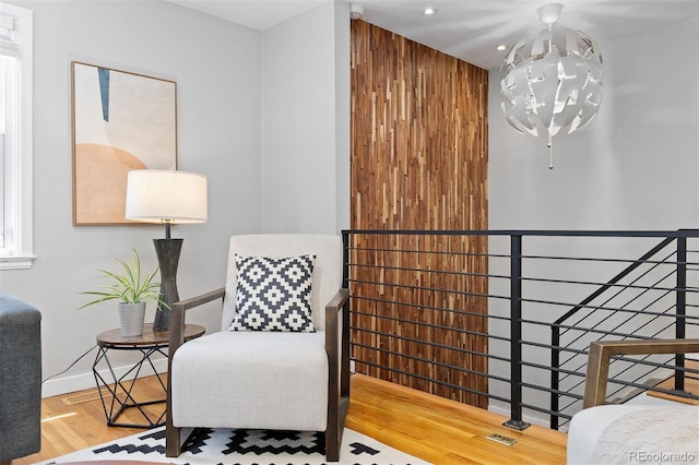 4451 Eliot St, Denver, CO 80211 - sitting room with an upstairs landing, recessed lighting, a chandelier, and wood finished floors
