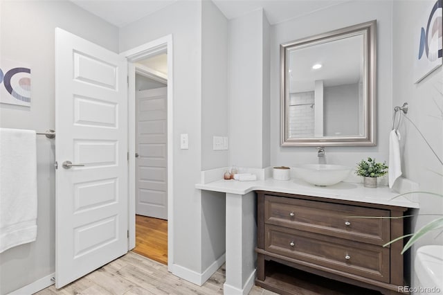 4451 Eliot St, Denver, CO 80211 - bathroom with vanity and wood finished floors