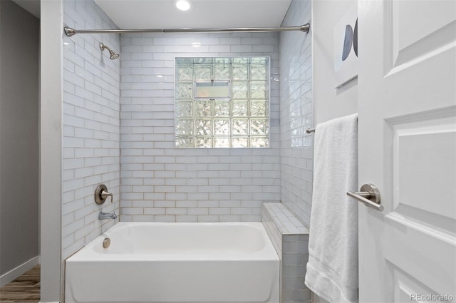 4451 Eliot St, Denver, CO 80211 - full bath featuring bathing tub / shower combination and wood finished floors