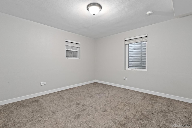 4451 Eliot St, Denver, CO 80211 - spare room with carpet, a smoke detector, and a textured ceiling