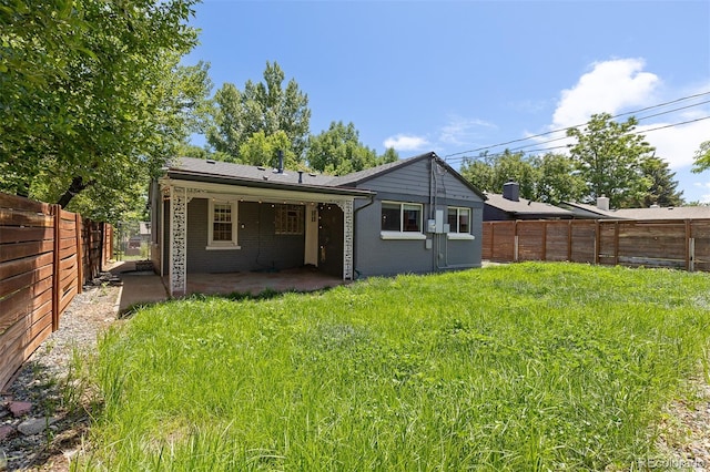 4451 Eliot St, Denver, CO 80211 - back of house featuring a patio area and a fenced backyard