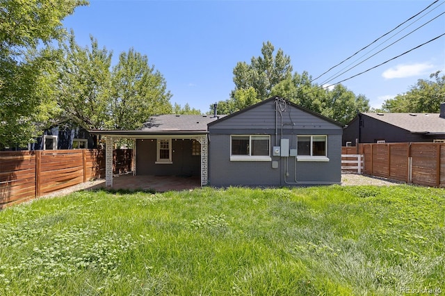 4451 Eliot St, Denver, CO 80211 - back of property featuring a fenced backyard, a patio, and brick siding