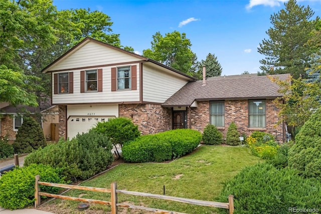 4677 S Wolff St, Denver, CO 80236 - tri-level home featuring brick siding and an attached garage