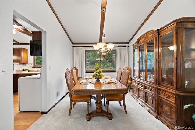 4677 S Wolff St, Denver, CO 80236 - dining room with washer / clothes dryer, a chandelier, crown molding, lofted ceiling, and light colored carpet